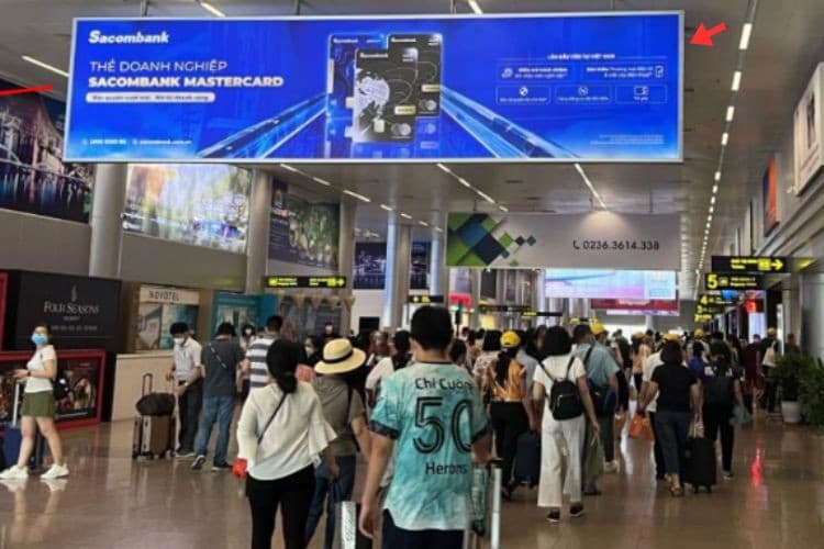 Day view - Horizontal Hoarding pano Billboard at Da Nang International Airport, Hoa Cuong Ward, Da Nang City (Level 1, hanging ceiling sign in the domestic arrival restricted area, facing the left wing)