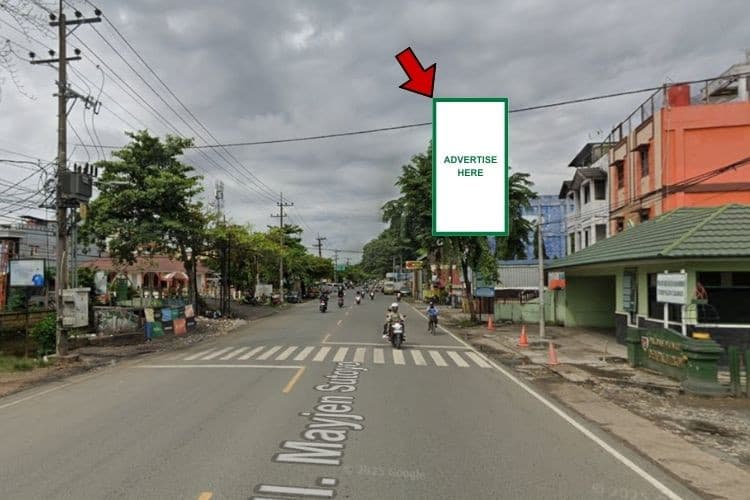 Vertical Static Billboard at Jl. Mayjen Sutoyo S, Banjarmasin, Kalimantan Selatan  (in front of Denpal VI/2 Banjarmasin) - Day vIew