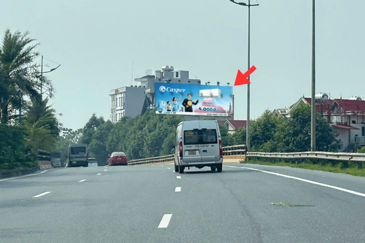 Day view - Horizontal Wallscape Billboard at Vo Nguyen Giap, Soc Son Ward, Ha Noi City (the route to Noi Bai Airport)