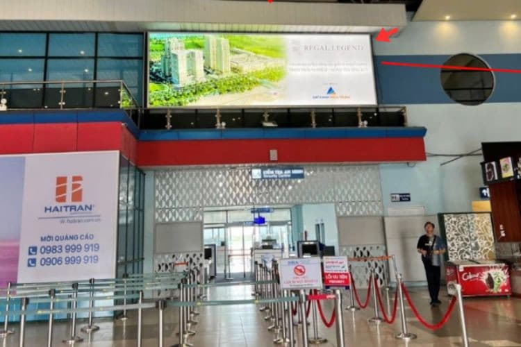 Day view - Horizontal Wall-mounted Pano Billboard at Dong Hoi Airport, Dong Thuan Ward, Quang Tri (Above the entrance to the departure security screening area)