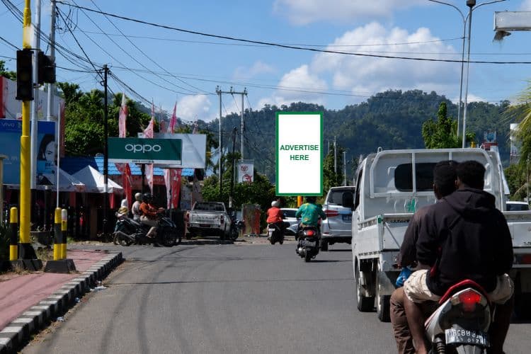 Vertical Static Billboard at Jl. Merdeka, Nabire, Papua Tengah near Merdeka Bridge